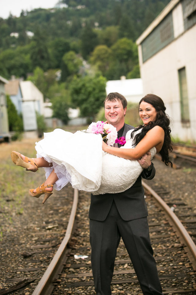 Justin picks up Jessica by the train tracks