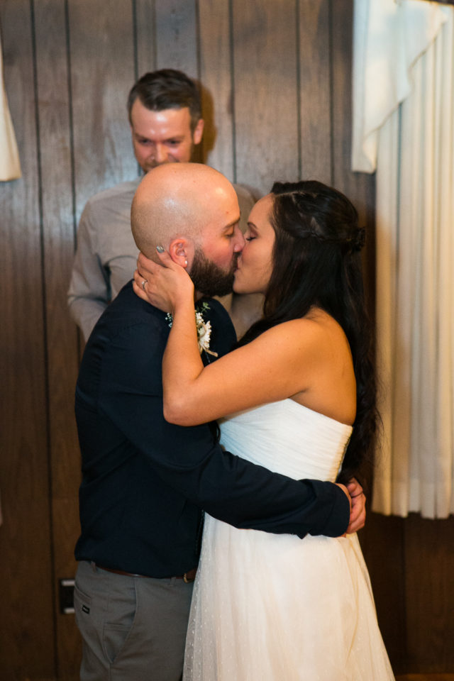 Daniel and Rose kiss at their wedding