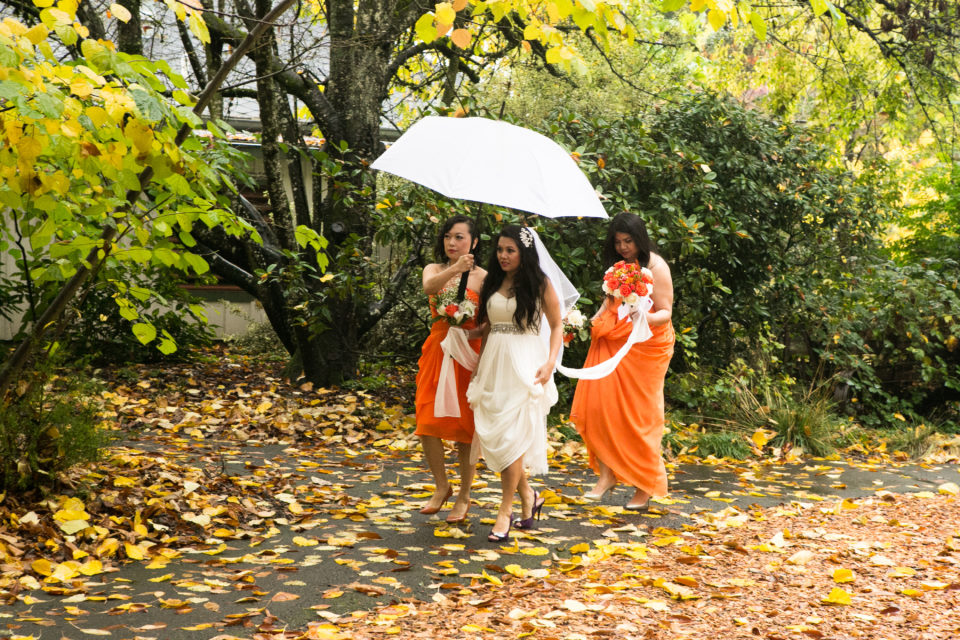 Viv and her bridesmaids walk towards the ceremony