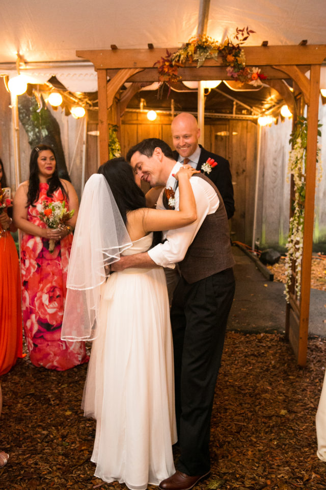 Viv & H share a kiss on their wedding day