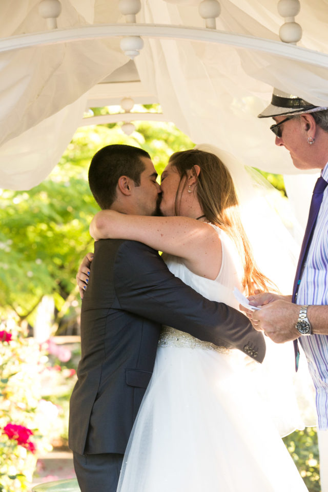 Van & Chavala kiss on their wedding day