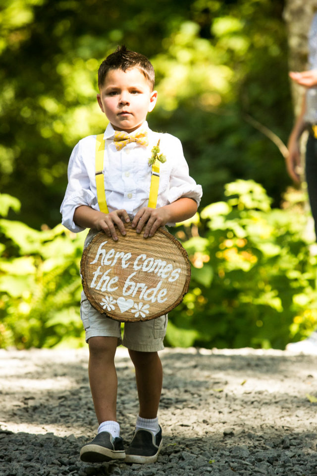 Boy holding sign at wedding